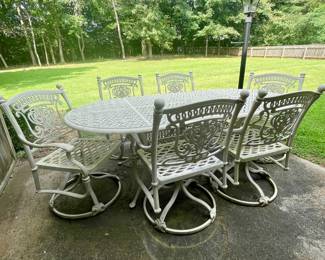 Very nice wrought iron table with 6  swivel chairs!
