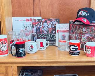 Vintage GA Bulldogs Mugs, Bulldogs Books, Caps (more caps upstairs closet), GA Bulldog puzzle.  Dooley's Play Book Autograph by Vince Dooley