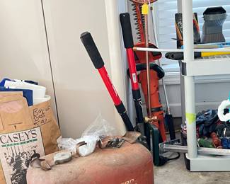 Old Johnson Gasoline Can, Copper Water Sprinkler, Black and Decker trimmers, Pruners