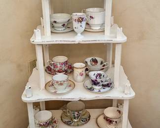 The white 4-tiered piece is sold.