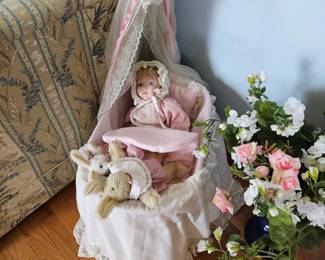 Porcelain doll with bassinet 