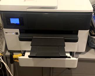 Office furniture including a dresser, multiple file cabinets, desktops and accessories. 