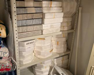 Marilyn Monroe collectible plates, metal shelving unit, wicker serving tray