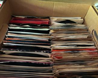 Dozens of boxes of vinyl records in original sleeves 