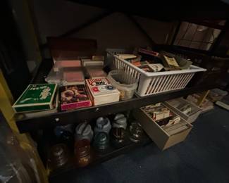 Antique glass telephone insulators, vintage playing cards