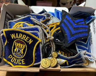 Warren and other police patches, badges, buttons