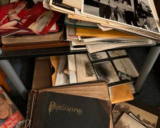 Pin up girls, tubs of antique photographs and books