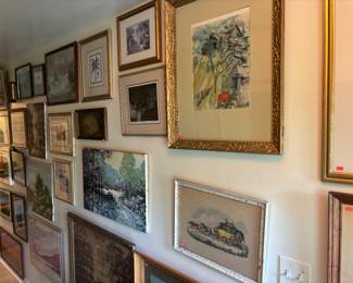 Hundreds of pieces of art on almost every wall and in stacks in the main room