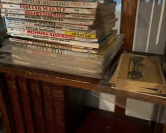 Vintage popular mechanics, antique automotive post cards, and automotive books