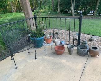 Wrought iron patio chair, flower pots