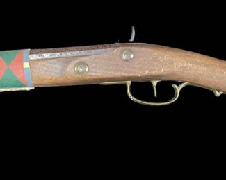 Wall-hanging black powder gun