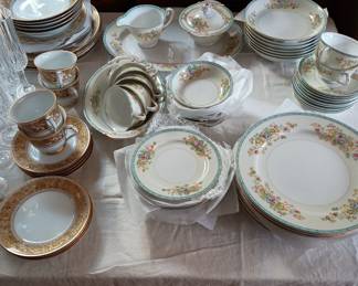 Gold dish set, on left  , service for 4 people 
Floral pattern Set  service for 6/7 with extras