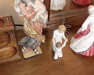 Hand carved figurine of Madonna and child on left