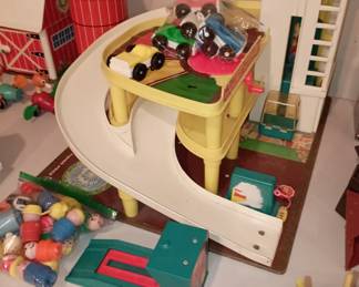 Fisher Price Action Garage with, cars and people, car lift. Overall in  good condition 