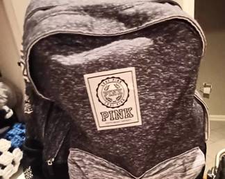 Lots of name brand backpacks and purses