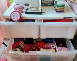 Many storage units full of crafting ribbon, yarn and beading wires