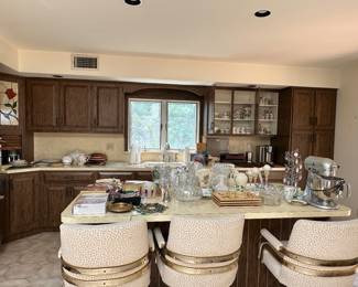 Island chairs are light cheetah print- there are three and matching 60” table and 5 matching chairs on wheels. Kitchen is stocked with small appliances (Keurig, Nutribullet, toaster, Kitchen Aid mixer)  Portmeirion mugs and accessories are available. Pfaltzgraff dishes, silverware, pots, glasses. Lenox and crystal clock and vases. 