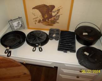 Cast iron - dutch oven is a Lodge, the pancake griddle is Griswold