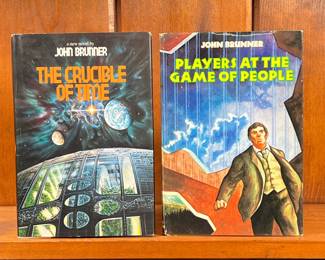 (2PC) JOHN BRUNNER SCIENCE FICTION BOOKS | Hardcover sci-fi books including "Players At The Game of People" and "The Crucible of Time". -  l. 6 x h. 8-1/2 in