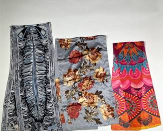 THREE LONG SCARVES | Three scarves in great condition. One scarf is by Warriors in Pink by Ford, bright and colorful Arabesque patterns. One Ralph Lauren scarf decorated with a floral pattern. And one Emilio Pucci scarf made in Italy, with a black and white graphic pattern and fringe edge. -  l. 68 x w. 12 in