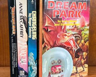 LOT OF FICTION BOOKS | Fictional mystery and Sci-fi. Books, include Dragon Slayer by Waylon Drew, Moreta by Anne McCaffrey, Changeling by Roger Zelazny, and Dream Park by Larry Niven and Steven Barnes. -  l. 6 x w. 1 x h. 8-1/2 in