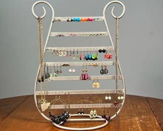 LARGE LOT JEWELRY & JEWELRY STAND | Costume jewelry, including multiple pairs of earrings, necklaces and more on a harp-form jewelry stand. - l. 10.25 x w. 5 x h. 13.5 in
