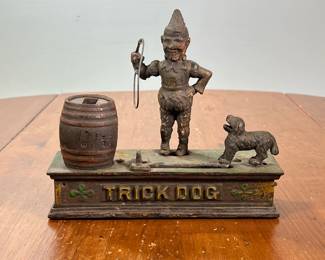 ANTIQUE CAST IRON TRICK DOG MECHANICAL BANK | l. 8-1/2 x w. 3 x h. 7-1/4 in
