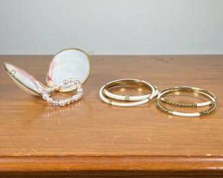 SEASHELL WITH PEARL BRACELET & BANGLE BRACELETS | Including 4 white and gold bangle bracelets, and a Seashell and pearl bracelet. 