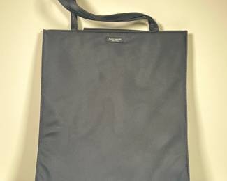 KATE SPADE HANDBAG | Black handbag by Kate Spade with polka-dot interior. - l. 13.5 x w. 4 x h. 16 in

