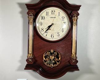 LISHENG MODERN WALL CLOCK | Almost in brand new condition working wall clock with all pieces intact. -  l. 15 x w. 3-1/2 x h. 22-1/2 in