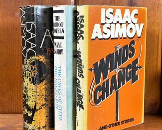 THREE SCI-FI BOOKS BY ISAAC ASIMOV | Mid-century science fiction books, including: The Robot Novels (The Caves of Steel, The Naked Son), The Winds of Change and Other stories, and The Far Ends of Time and Earth, each in hardcover. - l. 6 x h. 8-1/2 in