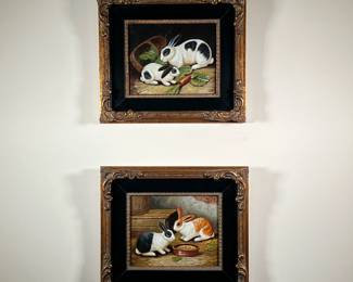 PAIR RABBIT PAINTINGS | Oil paintings in matching gilt frames, one showing two rabbits eating carrots and leaves, the other showing two rabbits eating outside eating from a bowl. - l. 16 x w. 14 in