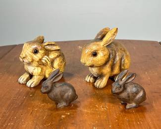 FOUR BUNNY RABBITS | Including a pair of carved wood rabbit figures and a pair of painted metal rabbits. -  l. 5 x w. 3 x h. 4-1/2 in