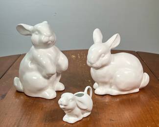 (3PC) CERAMIC BUNNY RABBITS | Decorative white rabbit figures, including a matching couple and a single gravy pitcher/creamer. - l. 7 x w. 4 x h. 7 in