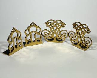 TWO PAIRS OF BRASS BOOKENDS | Two pairs of bookends one pair marked Monticello, the other pair marked Thomas Jefferson cipher. - l. 6 x h. 5-1/2 in