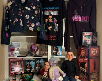 Jeff's Autographed merchandise. His mom's denim jacket covered in pins and Audrey Dunham's cookbook.