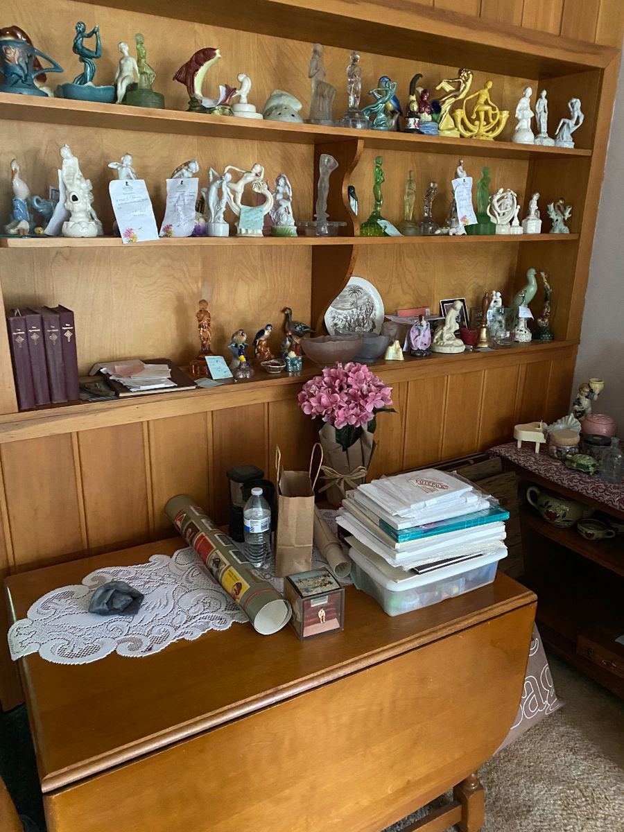 Mid century shelves and built-in cabinets filled with 1950s and before pottery