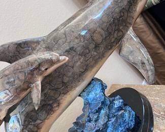 I think the one is an artist proof-the original cast