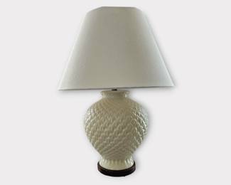 One of a pair of cream colored ceramic Lamps and shade