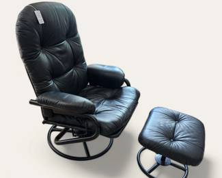 Black leather Adjustable recliner with ottoman.