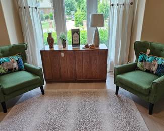 Pair of green occasional chairs in office