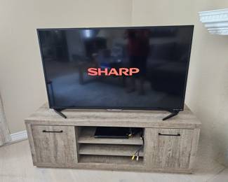 Sharp flat screen TV on  Rustic TV Cabinet?