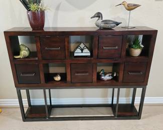 Darkwood cabinet with five drawers and cubbies