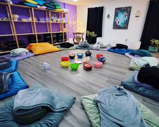 meditation yoga mats pillows blankets shelving crystal bowls gong