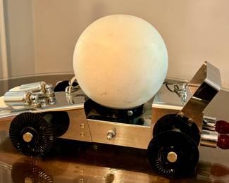 Vintage Racing Car Hanging Light Fixture 

Fun and unique design! In overall good vintage condition with some light wear

The car measures about 18" l x 9.5" h 