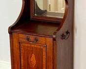 Antique English Mahogany and Rose Wood Coal Cabinet 

Features a beautiful inlaid design. Measures 16" x 14" x 36.5" 