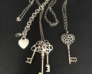 Sterling silver keys on sterling silver chains, a Tiffany sterling silver bracelet