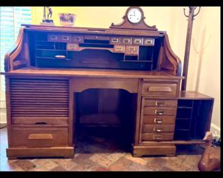Circa 1900 Rolltop Desk in mint condition with 'Pull and Swivel" file drawer (see lower right corner of the desk)  made of quarter sawn oak, raised panels, and tambour top. Purchased from Harp Gallery, Appleton, Wisconsin 