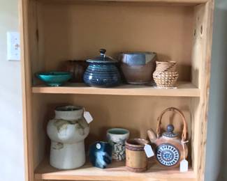 The primitive room includes pottery, basketry, antique furniture, art, apothecary, clocks. 