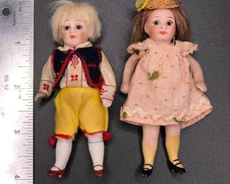 Antique German Kestner mignonette dolls in original dress, boy and girl. 